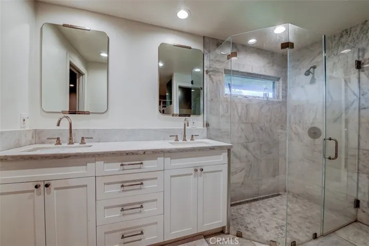 Spa like bathroom with double sinks.