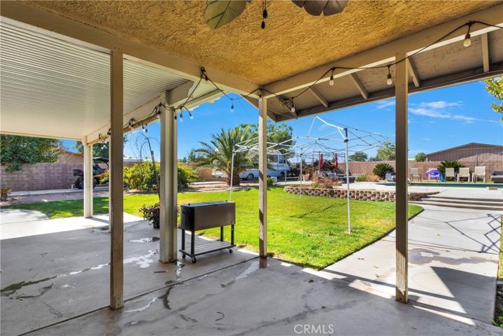 Shaded patio area with lots of entertainment space.