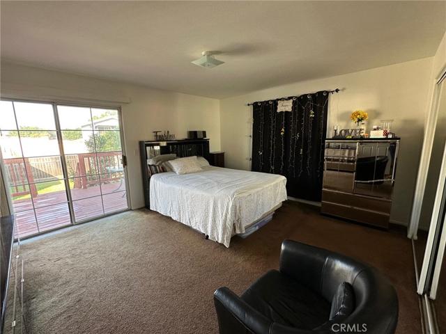 Master bedrooom with view of​​‌​​​​‌​​‌‌​‌‌​​​‌‌​‌​‌​‌​​​‌​​ deck