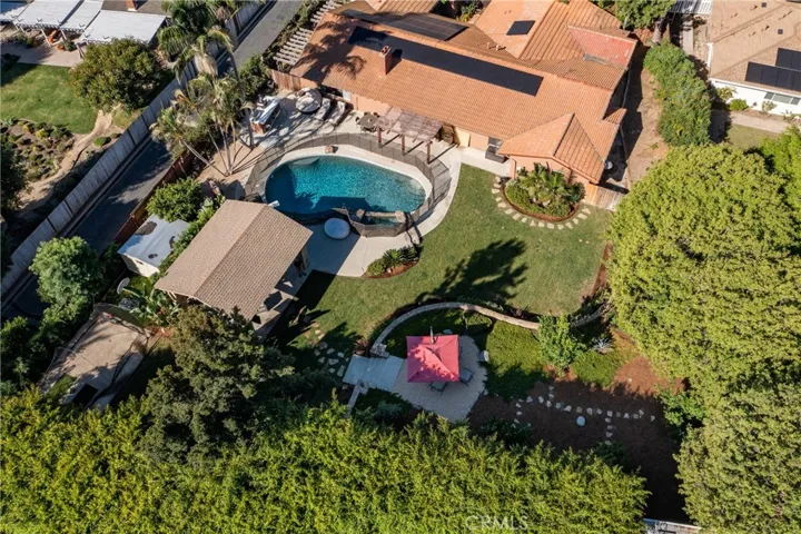 Own your own paradise w/an outside Pavillion, fruit orchard, pool, spa, backyard BBQ area and a large grassy area