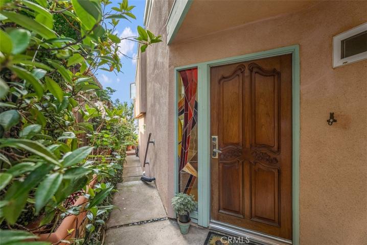 Private entry with stained glass accent window