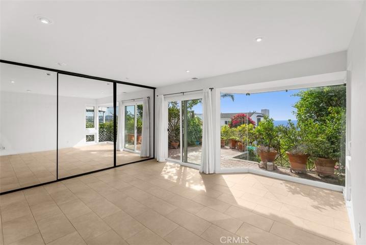 Lower level bedroom with a wall of glass