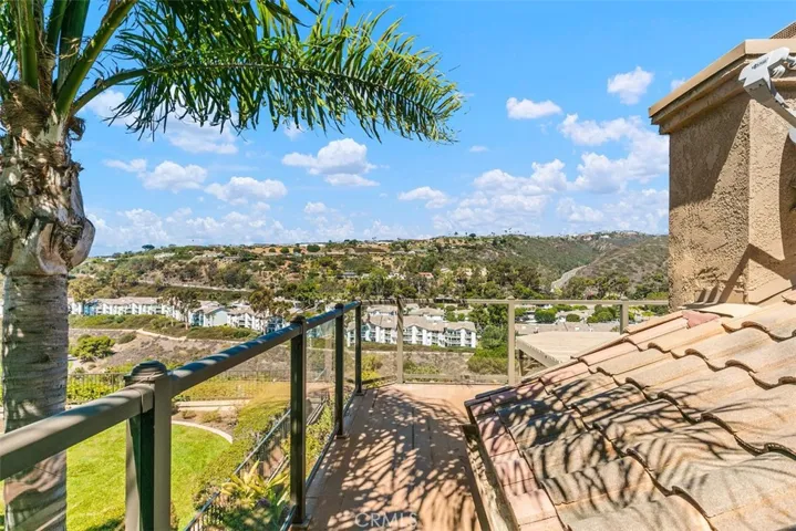 West facing views of hills, golf course + ocean to south.