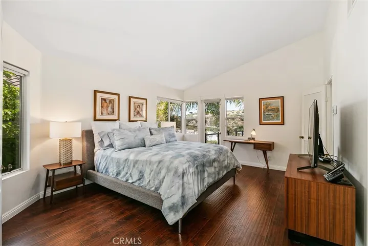 View of primary bedroom with ocean view balcony.