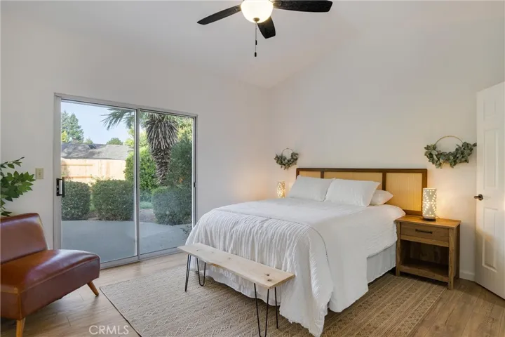 Primary bedroom with slider leading to back yard.