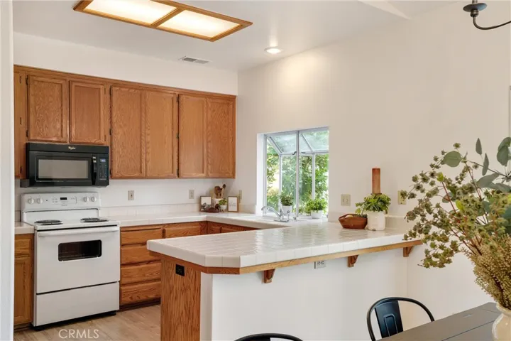 A view of the kitchen off the dining room.