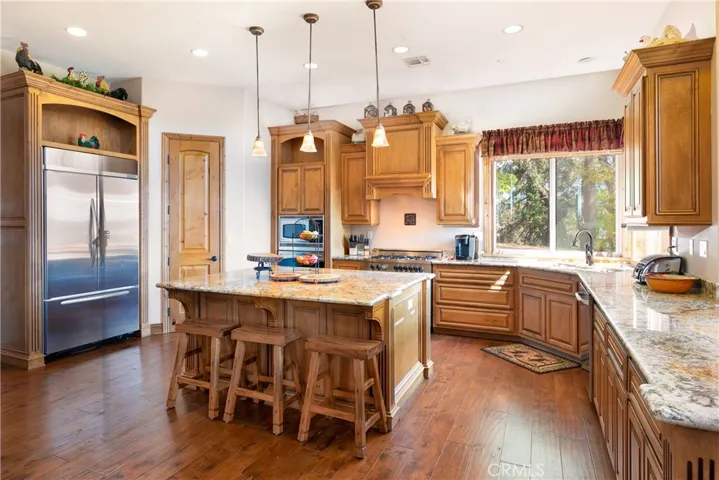 Kitchen with Granite Counters, Island and Views