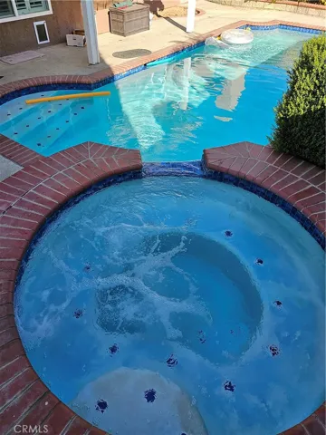 Spa waterfalls in to pool