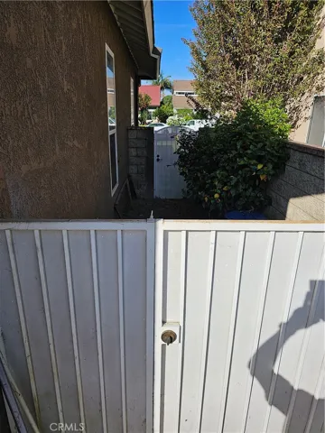 Side yard with gate for pets when hosting for friends
