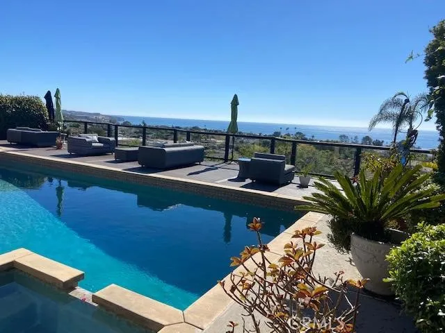Entertaining backyard with gorgeous ocean views, pool & spa.