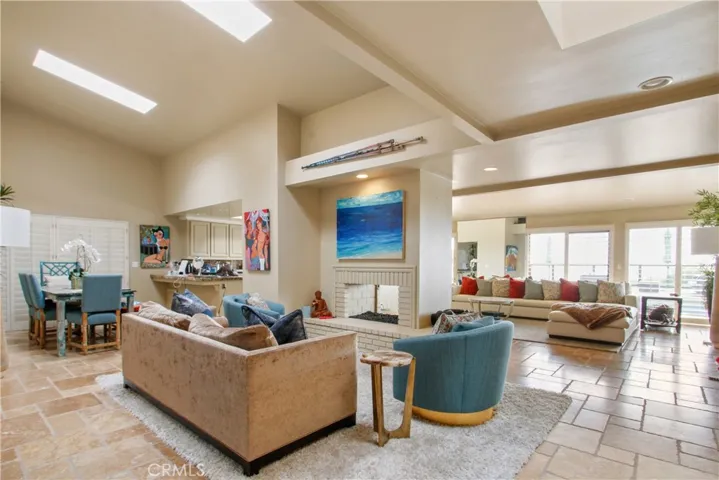 Family room featuring a fireplace and dining room.