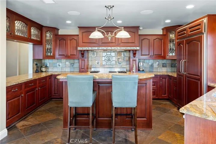Island with countertop seating.
