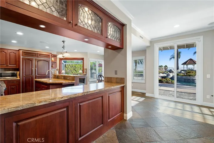 Kitchen peninsula and sliding door to the backyard.