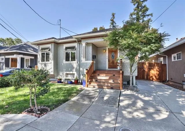 There's ample driveway space for 3-4 cars and there's a hearty, custom, double door gate