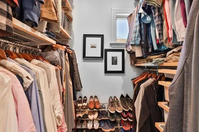 Walk-in closet, conveniently located as part of the primary bathroom suite.