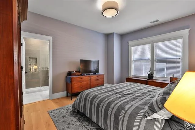 Calming paint colors and designer light fixture.