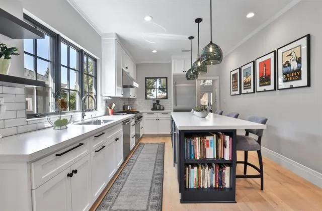 Dual temp beverage fridge; microwave drawer; S/S dishwasher; huge sink with sleek, chrome fixtures