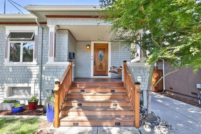 Sit on the porch swing and enjoy the view of the other charming homes on the lovely treelined street