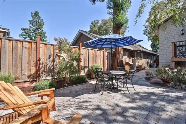 Private backyard with majestic redwood trees. A great area for BBQing and entertaining.