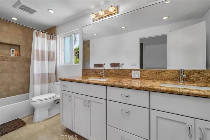 Large bathroom to accommodate the upstairs bedrooms with self-closing drawers, dual sinks