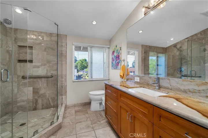 Remodeled 3/4 bathroom with large shower, recessed lighting, tile floor