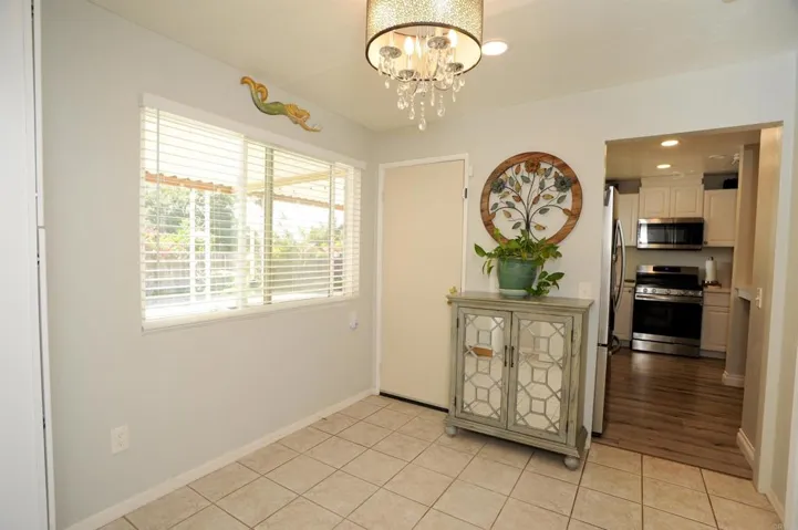 The den has door to back covered patio with nice views