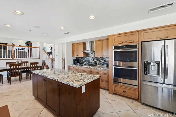 stainless steel appliances, kitchen is open to to great room