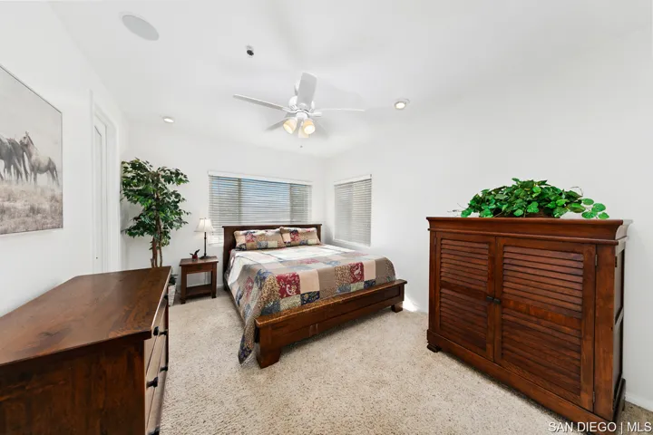 Large laundry room with deep sink and exit out to pool area