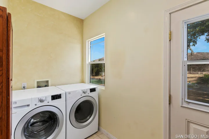 Master bathroom jacuzzi tub boasts amazing views. Relax with your favorite music and drink after a