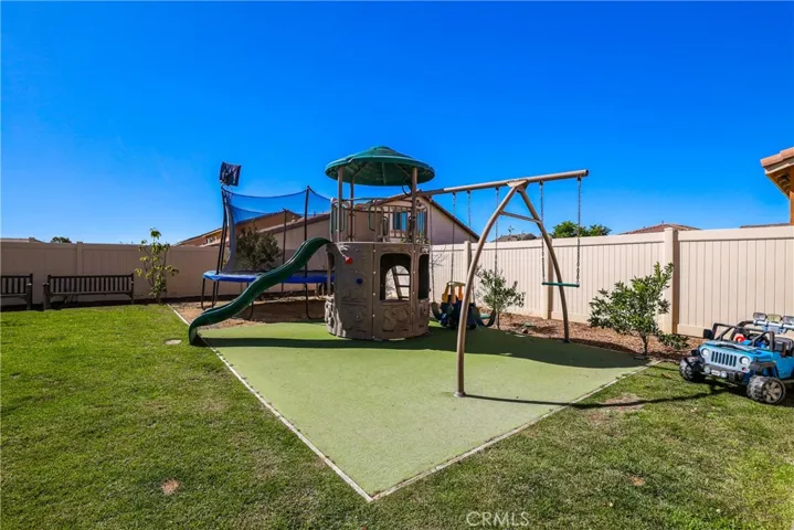 Fully landscaped and hardscaped backyard.
