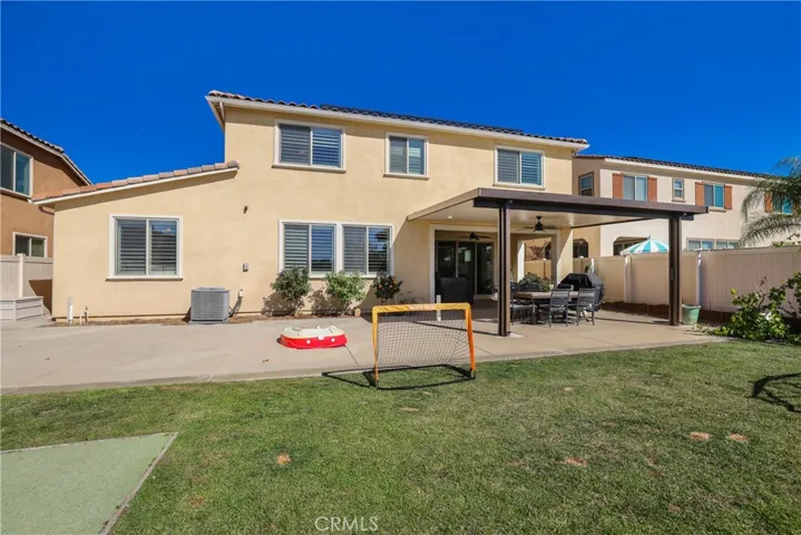 Fully landscaped and hardscaped backyard.