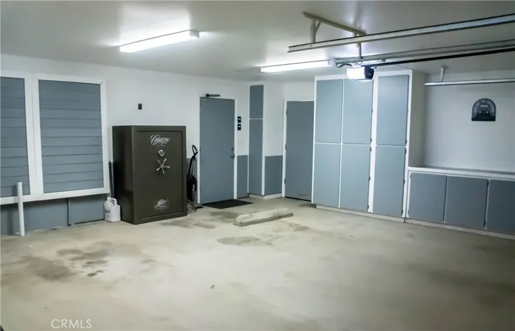 Attached 3 car garage is completely finished with 2 insulated doors with openers.