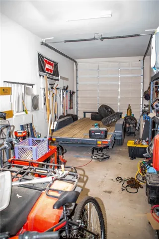 36 foot deep finished RV garage with 220v power, tall ceilings and garage.