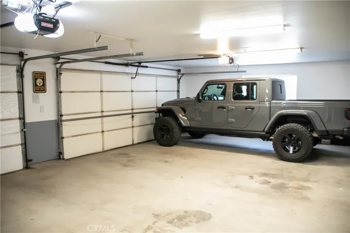 Attached 3 car garage is completely finished with 2 insulated doors with openers.