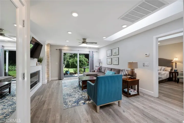 Living Room with Recessed Lighting, Sliding Glass Door to the Back Patio, and LVT flooring!