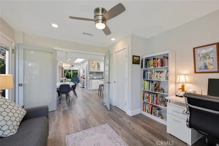 Bedroom #2 currently used as an Office has Recessed Lighting, Ceiling Fan/Light, and French Doors that open to the Main Living Area of the home!