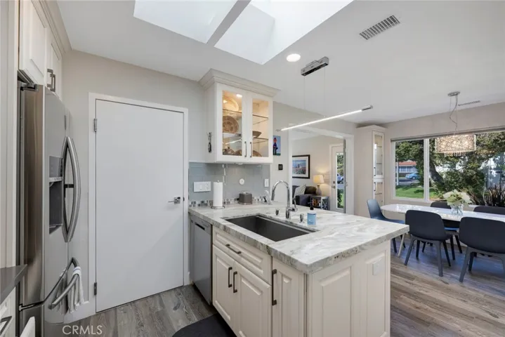 Large Dining Room Window provides views of the neighborhood and Lushly Landscaped Grounds!