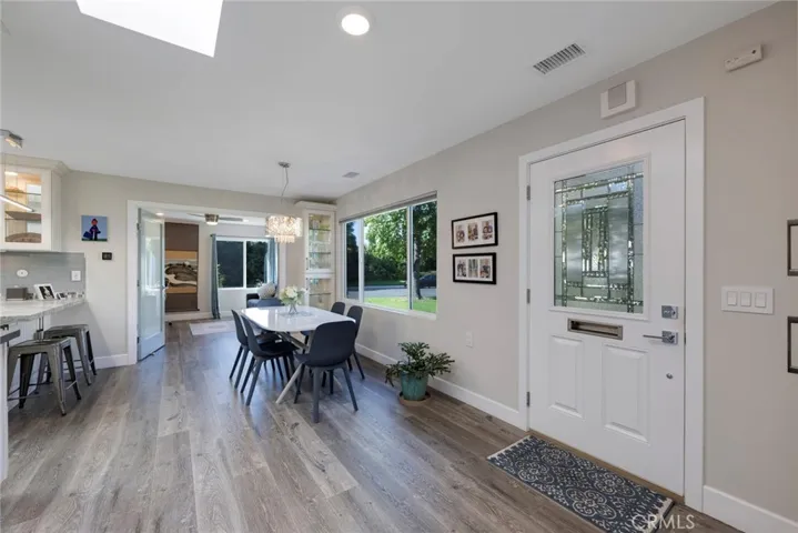Dining Room with Chandelier and Large Window with Gorgeous Views of the Yard!
