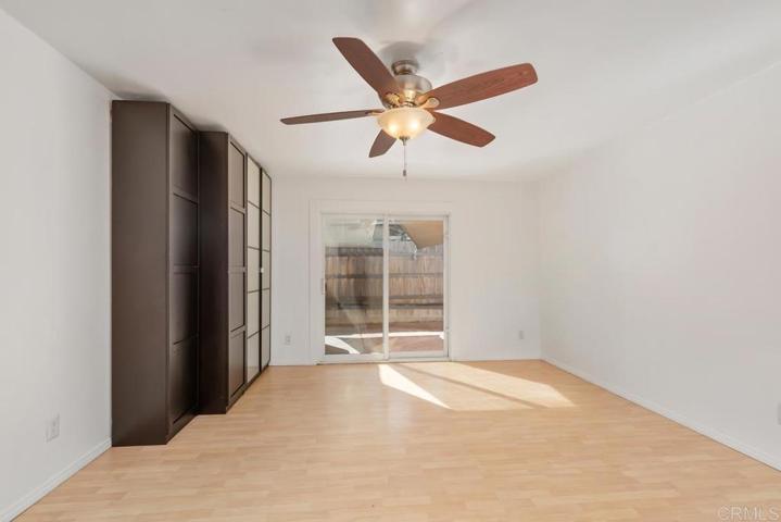 Bedroom #4 with sliding doors to the side yard.