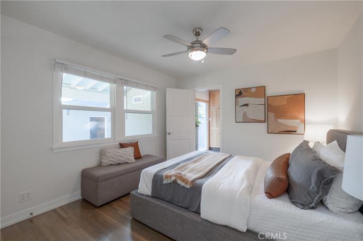 Bedroom 2, features wood flooring & Milgard windows.