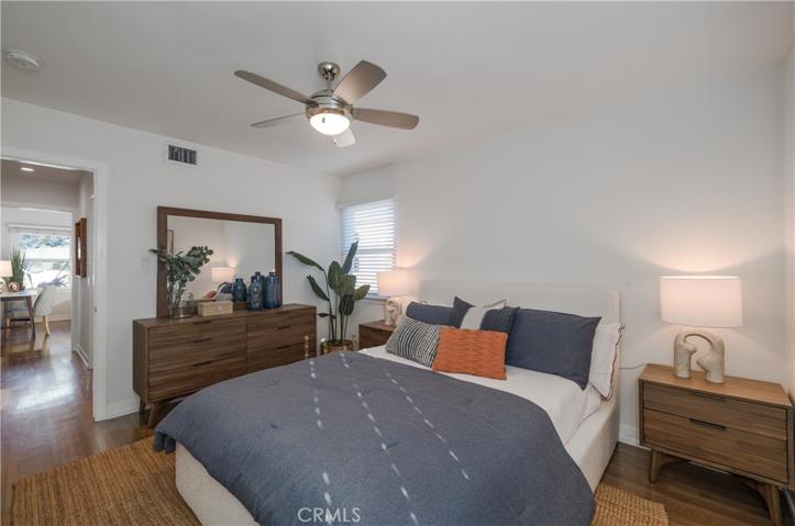Bedroom 3 features wood flooring & Milgard windows.