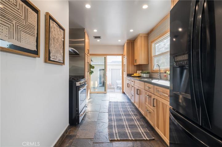 Slider off of the kitchen opens up to a fully landscaped backyard.