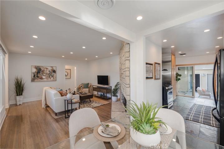 Adorable dining area is between the living room & kitchen.
