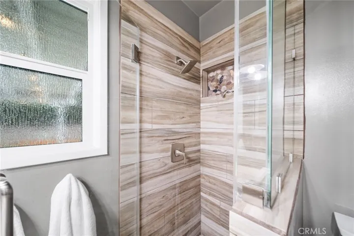 Tile show with glass enclosure