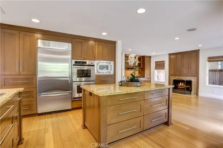 Large custom island, double ovens, large fridge. Kitchen is open to family room