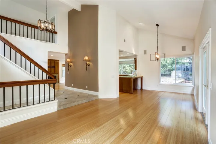 Dual pane windows, bamboo flooring, wrap around yard, custom lighting and open floor plan.