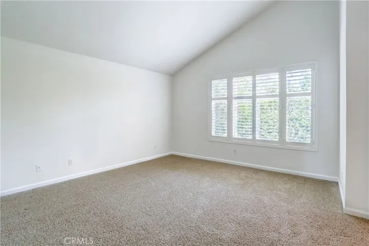 Spacious master bedroom with plantation shutters
