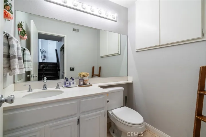 Downstairs powder room with additional storage