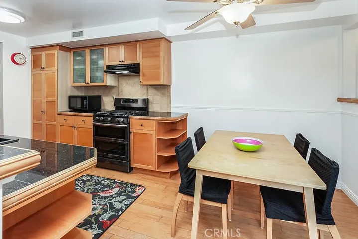 The dining room fittingly adjoins the kitchen and family room, and with its rich hardwood floors it is perfect for any occasion.