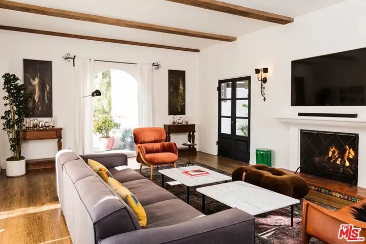 Step down living room Hardwood Floors & Beamed Ceiling